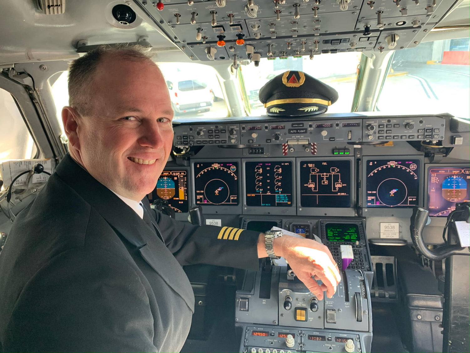Special Tribute Spirits' artist Dan White in the cockpit of a commercial airliner.
