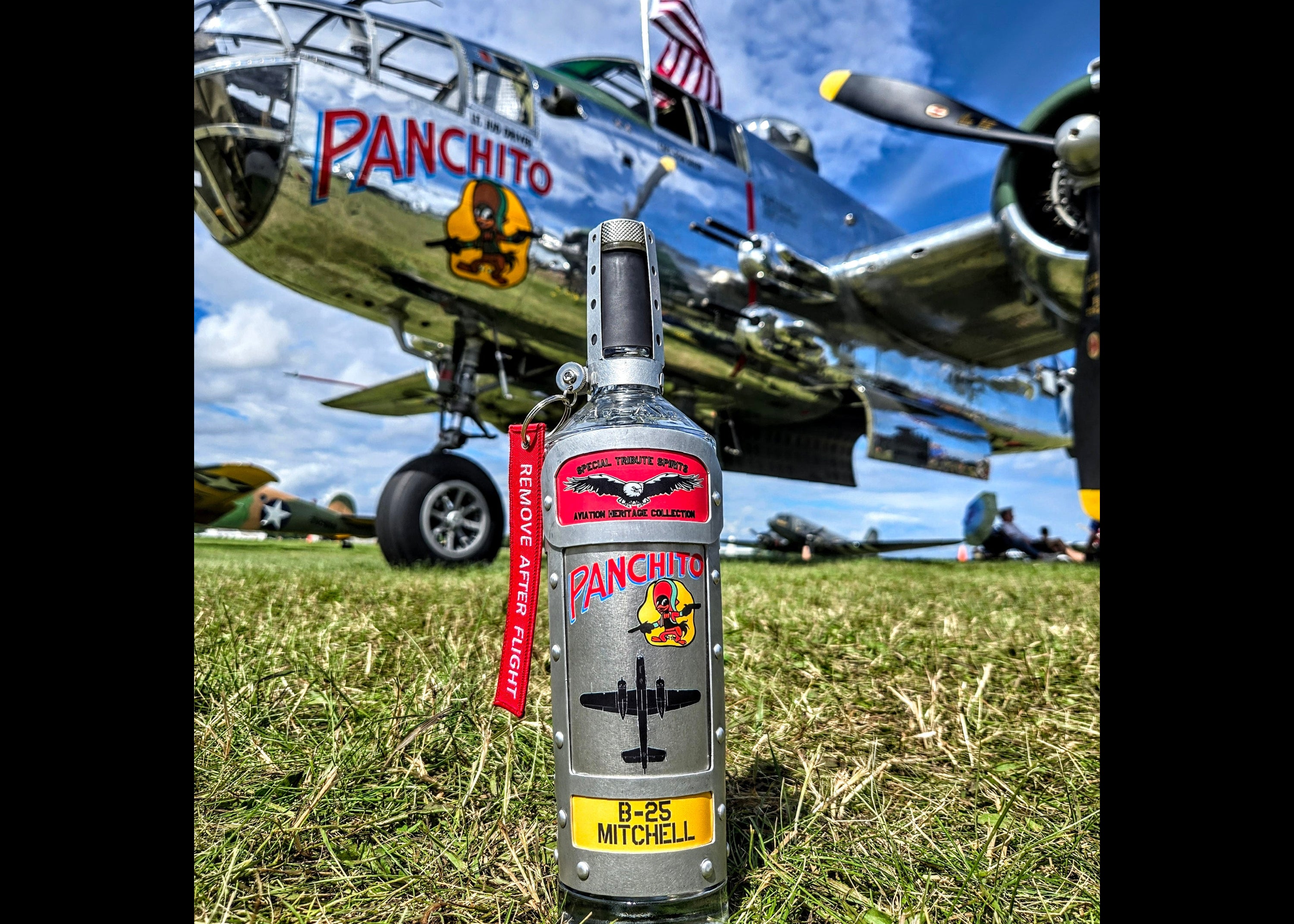 Photo of Special Tribute Spirits' "Panchito" decanter positioned on grass in front of the actual North American B-25J Mitchell Panchito bomber. 